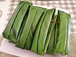 Bruneian kuih wajid wrapped in phacelophrynium maximum (nyirik) leaves similar to the wrapping of kelupis and lamban