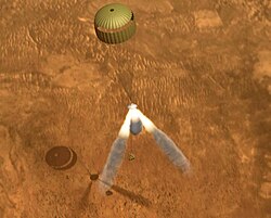 Descent is halted by retrorockets and lander is dropped 10 m (33 ft) to the surface in this computer generated impression.