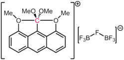 This anthracene derivative contains a carbon atom with 5 formal electron pairs around it.