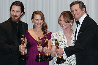 Academy Award winners for 2011 (from left to right):- Christian Bale, Best Supporting Actor—The Fighter- Natalie Portman, Best Actress—Black Swan- Melissa Leo, Best Supporting Actress—The Fighter- Colin Firth, Best Actor—The King's Speechwith trophies known as Oscars