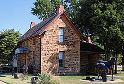 The historic sandstone Blacksmith's House in Pawhuska, Oklahoma. Listed on the National Register of Historic Places.