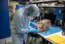 Engineers prepare the Mass Spectrometer Observing Lunar Operations (MSolo) instrument