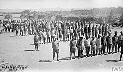 Jilu Assyrian recruits drilled by British soldiers in Hamadan, 1918