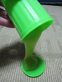 Slime flows under low stresses but breaks under higher stresses