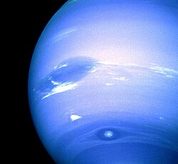 The Great Dark Spot (top), Scooter (middle white cloud),[124] and the Small Dark Spot (bottom), with contrast exaggerated