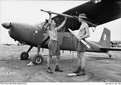 161 (Independent) Reconnaissance Flight ground crew load 2.75 inch white phosphorus rockets onto a Cessna 180 at Vung Tau Air Base in 1966