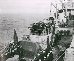 Rear Admiral Popov speaks aboard an Admirable-class minesweeper during the ship's transfer ceremony, probably on 21 or 22 May 1945.[11]