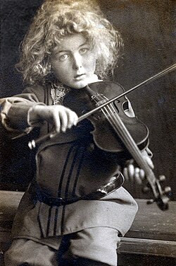 Henry playing the violin — aged 5 (c. 1902)