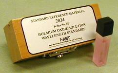 A solution of 4% holmium oxide in 10% perchloric acid, permanently fused into a quartz cuvette as a wavelength calibration standard