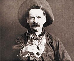 A famous shot from the 1903 film The Great Train Robbery. Scenes where criminals aimed guns at the camera were considered inappropriate by the New York state censor board in the 1920s, and usually removed.[41]