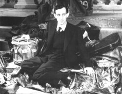 Guinness at the Old Vic theatre, London in 1938. Joining the company in 1936, early roles include Boyet in Love's Labour's Lost, Le Beau in As You Like It, and Osric in Hamlet.[11]