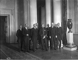 The ministers of Lykke's Cabinet with Crown Prince Olav at the Royal Palace in Oslo.