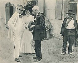 A physician consulted on the street by a farmer (Italy, ~1900)