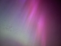2024 appearance seen in England radiating blue through red aurora