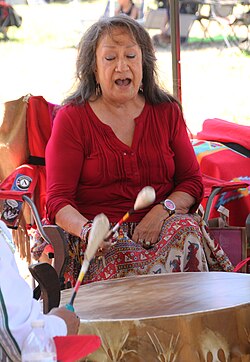 Mildred "Midge" Wagner, a Lakota woman, singing at a pow wow in 2015