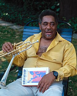 Gillespie holding his memoir: To Be or Not to Bop (1979)