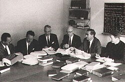 The GNT Committee, from right to left: Carlo Maria Martini, Kurt Aland, Allen Wikgren, Bruce Metzger and Matthew Black (with Klaus Junack, Aland's assistant), c. late 1960s