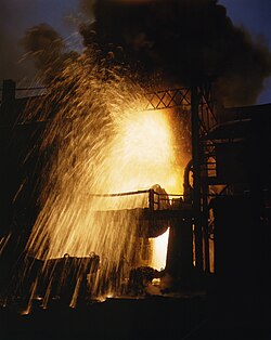 Spray of sparks from a Bessemer converter as air is blown through the molten metal