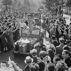 Cheering crowds greet British troops entering Brussels, 4 September 1944.