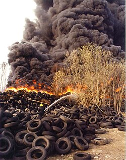 Toxic fumes emerging from a fire at a tire dump.