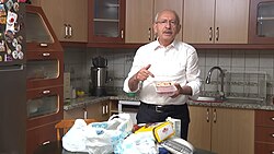 Kılıçdaroğlu in his kitchen talking about increased grocery prices, May 2023