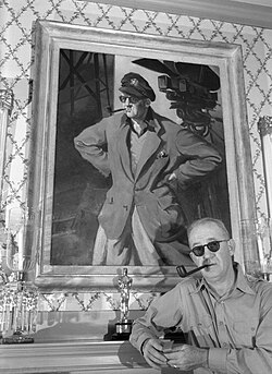 John Ford with portrait and Oscar, circa 1946