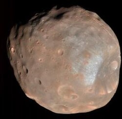 An image of Phobos taken by HiRISE on March 23, 2008, from a distance of around 6,800 kilometres (4,200 mi)[88]