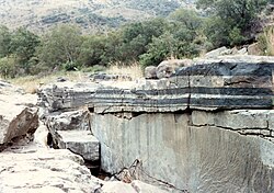 Dark layers of chromite-rich cumulate rock alternating with light layers of plagioclase-rich rock in the Bushveld Igneous Complex, South Africa