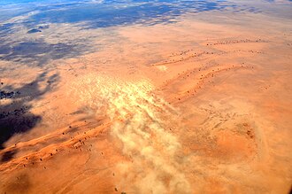 An aerial view of a sandstorm over the Namib Desert