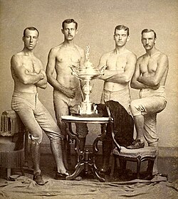 Yale's four-oared crew team posing with the 1876 Centennial Regatta trophy, won in Philadelphia, Pennsylvania