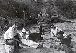 The "Suicide Squad" of (left to right) Rudolph Schott, Apollo Milton Olin Smith, Frank Malina, Ed Forman and Jack Parsons testing their first liquid-fueled rocket engine.[5]