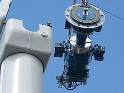 Typical components of a wind turbine (gearbox, rotor shaft and brake assembly) being lifted into position