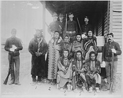 "Eight Crow prisoners under guard at Crow agency, Montana, 1887"