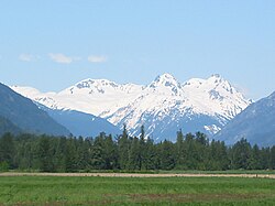 The Mount Meager massif as seen from the east near Pemberton, British Columbia: Summits left to right are Capricorn Mountain, Mount Meager, and Plinth Peak.