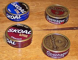 Four cans (or tins) of dipping tobacco/moist snuff