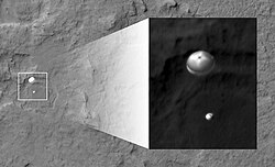 NASA's Curiosity rover and its parachute were spotted by NASA's Mars Reconnaissance Orbiter as the probe descended to the surface. August 6, 2012.