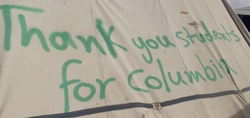 "Thank you students for Columbia" spray-painted on a tent in Rafah, April 2024.