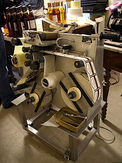 A wine labelling machine with adhesive labels in France
