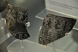 Fragments of a vessel dedicated to the temple of Nergal in Nineveh, showing Shalmaneser III kneeling before Nergal, currently held in the British Museum in London