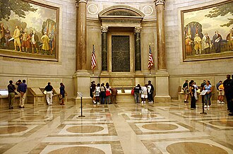 The National Archives' Rotunda for the Charters of Freedom in Washington, D.C. where, in-between two Barry Faulkner murals, the original Bill of Rights, Constitution, Declaration of Independence, and other American founding documents are publicly exhibited.