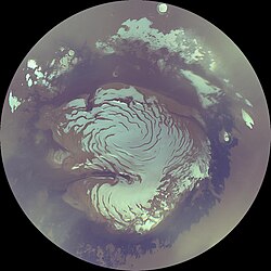 Composite image of the north polar cap in 2006. The dark ring surrounding the polar cap is sand dunes.