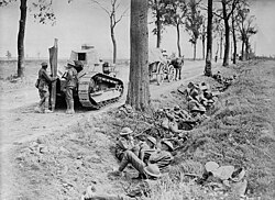 Canadian troops shelter in a ditch during the Battle of Cambrai.