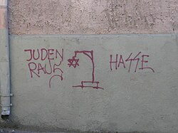 Antisemitic graffiti in Lithuania. The words read Juden raus (German for Jews out) and Hasse (presumably a misspelling of Hass, German for hate).