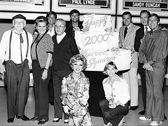 The 2000th show in 1974. Back row, L-R: Cliff Arquette as Charley Weaver, Rose Marie, John Davidson (who later hosted the 1986 revival of the show), George Gobel, Kent McCord, Peter Marshall, Vincent Price and Paul Lynde. Front row: Ruta Lee and Sandy Duncan.