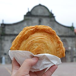 Empanada de kaliskis (lit. 'fish scale empanada'), a traditional empanada from Bulacan, Philippines, with a croissant-like flaky layered crust