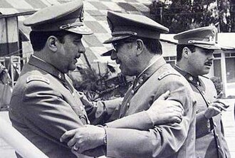 Generals Sergio Arellano Stark (left) and Augusto Pinochet embracing a few hours before the departure of the Caravan of Death (September 1973)