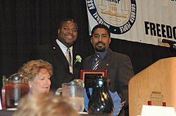 Dayton NAACP President Derrick Foward presents Strahorn with the President's Award