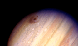 Comet Shoemaker-Levy 9's scar on Jupiter (dark area near Jupiter's limb)