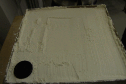 Animation of an analogue experiment showing the origin of a mock volcanic caldera in box filled with flour