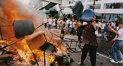 Riots on the streets of Jakarta on 14 May 1998, part of a wave of civil unrest that involved attacks on people and property directed predominantly against Chinese Indonesians[207]